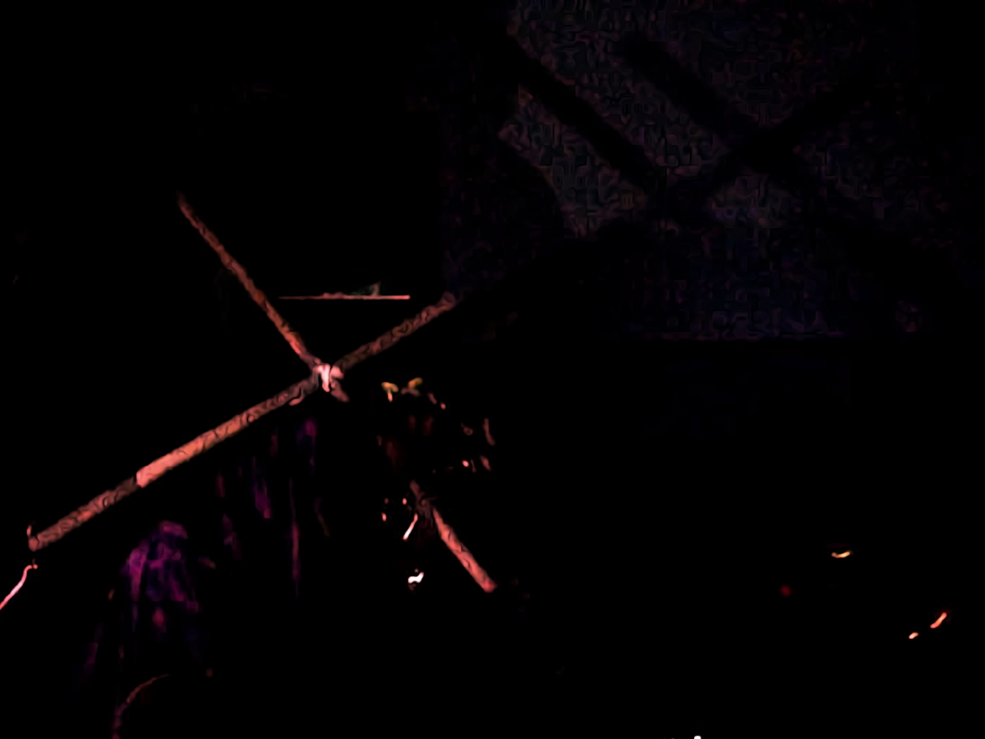 darkened image, cross illuminated a little bit on left side