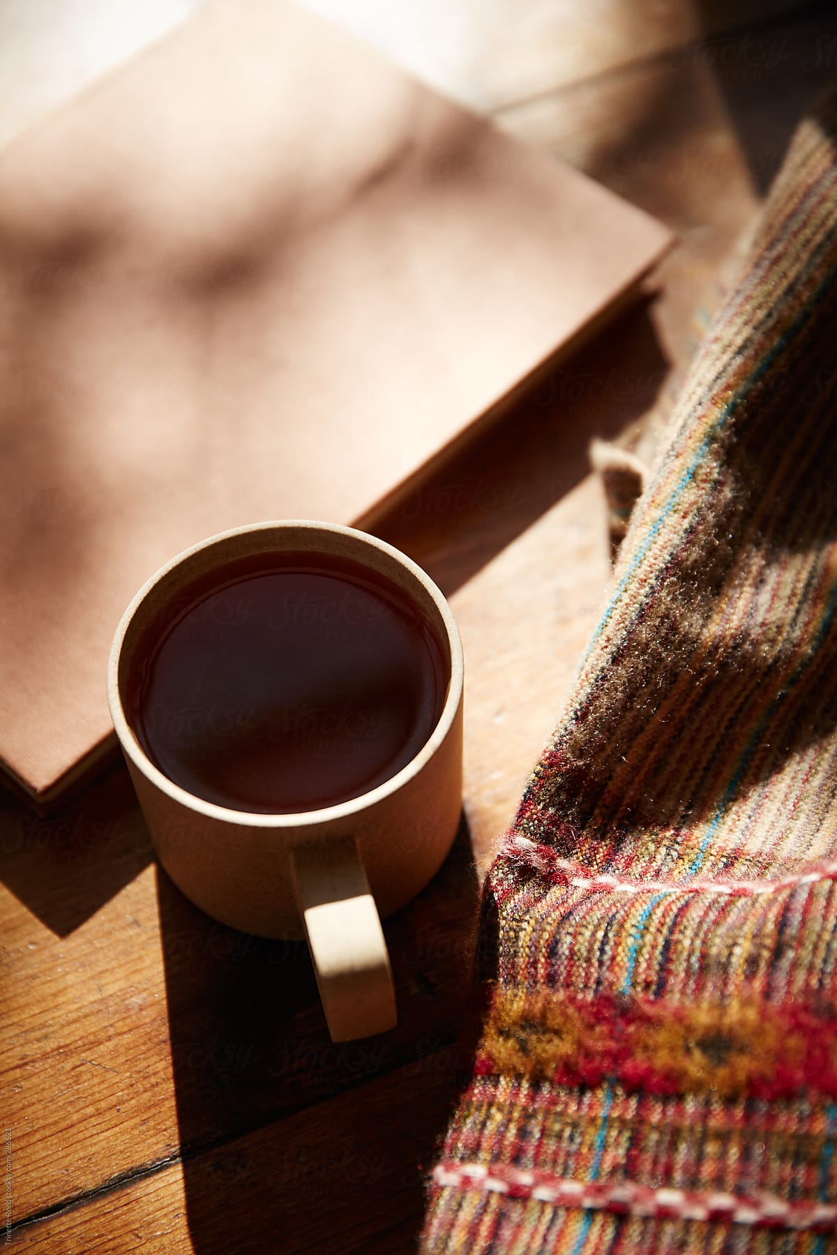 Photo of mug and woven cloth next to it.