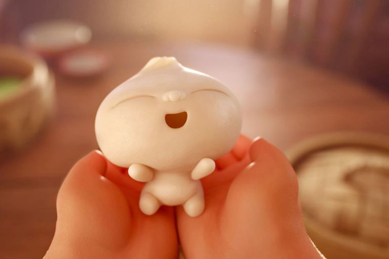 Image of dumpling (bao) baby character held in hands.