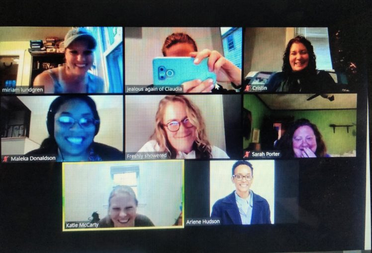 Eight women on a Zoom call, faces smiling.
